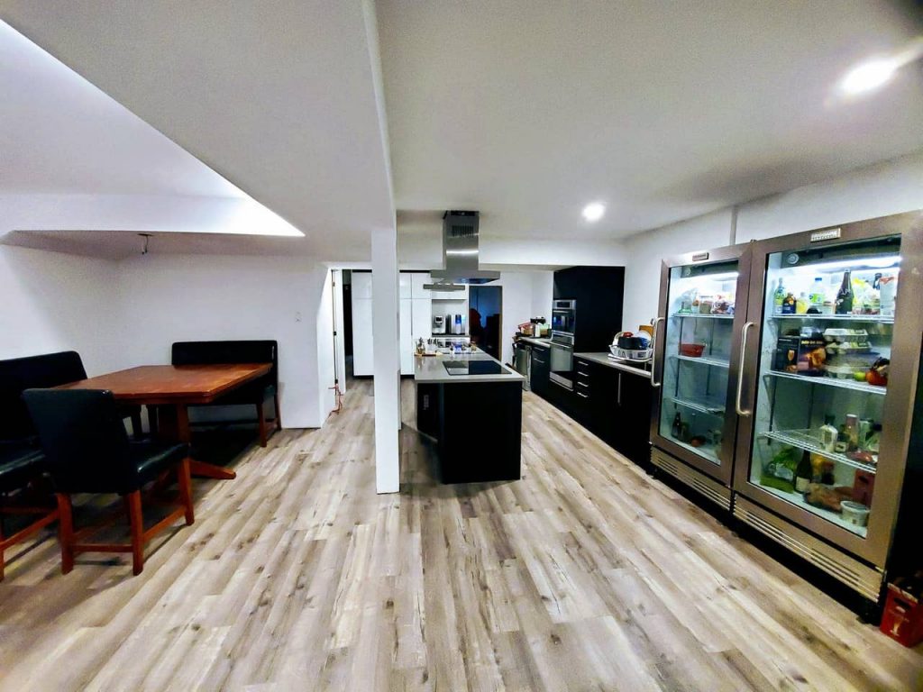 a kitchen with a table and refrigerators