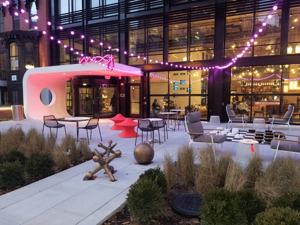 a building with a patio and chairs