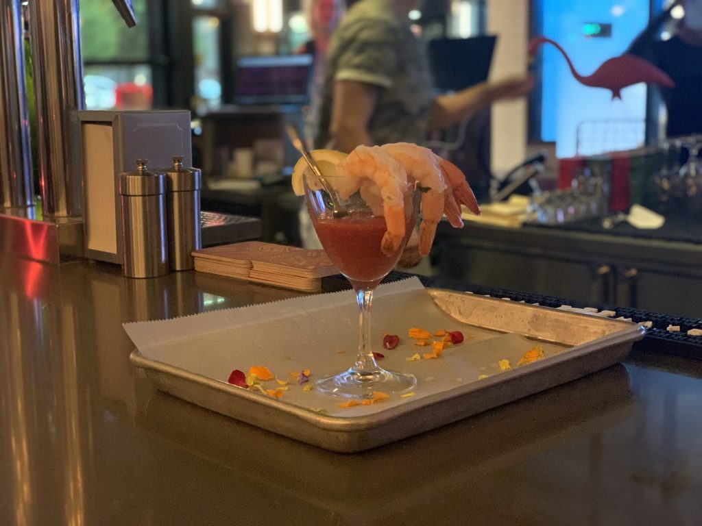 a shrimp on a glass of liquid
