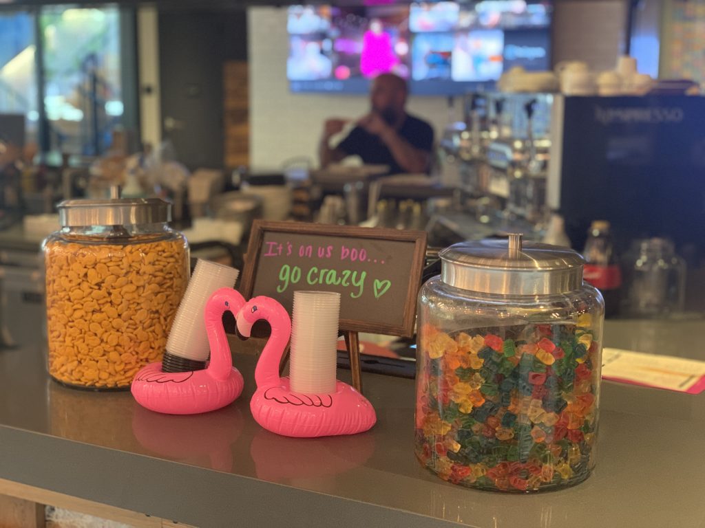 a couple of flamingos and candy in a jar