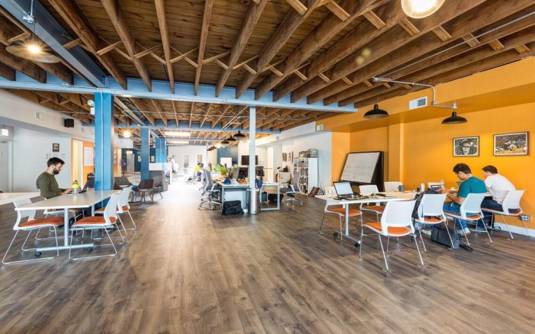 a room with a wood floor and a wood ceiling