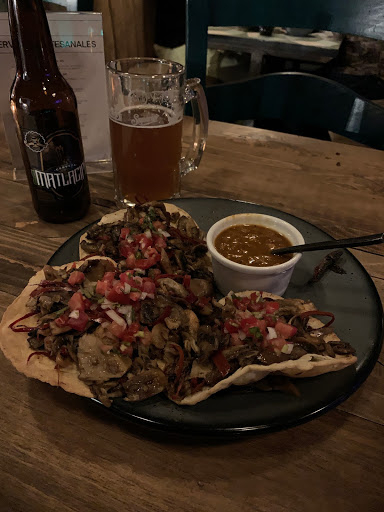 a plate of food and a beer
