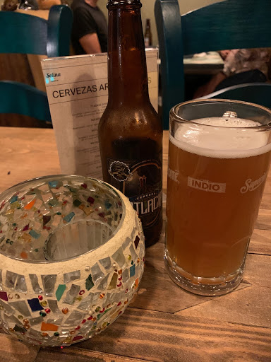 a glass and bottle on a table