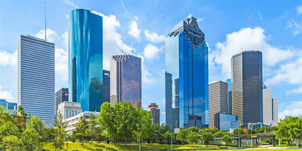 a group of tall buildings in a city