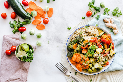 a bowl of vegetables and a fork