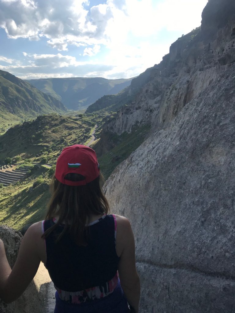 a woman looking at a valley