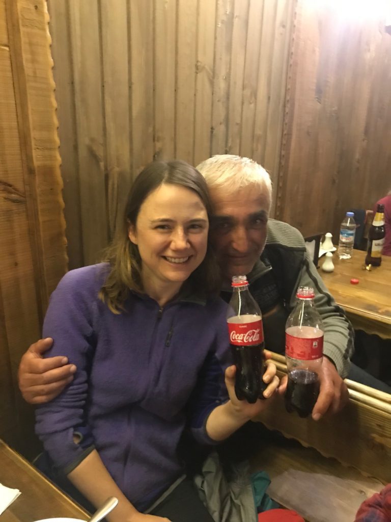 a man and woman holding bottles of soda