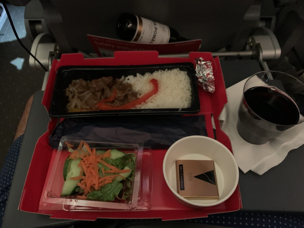 a tray of food on a plane