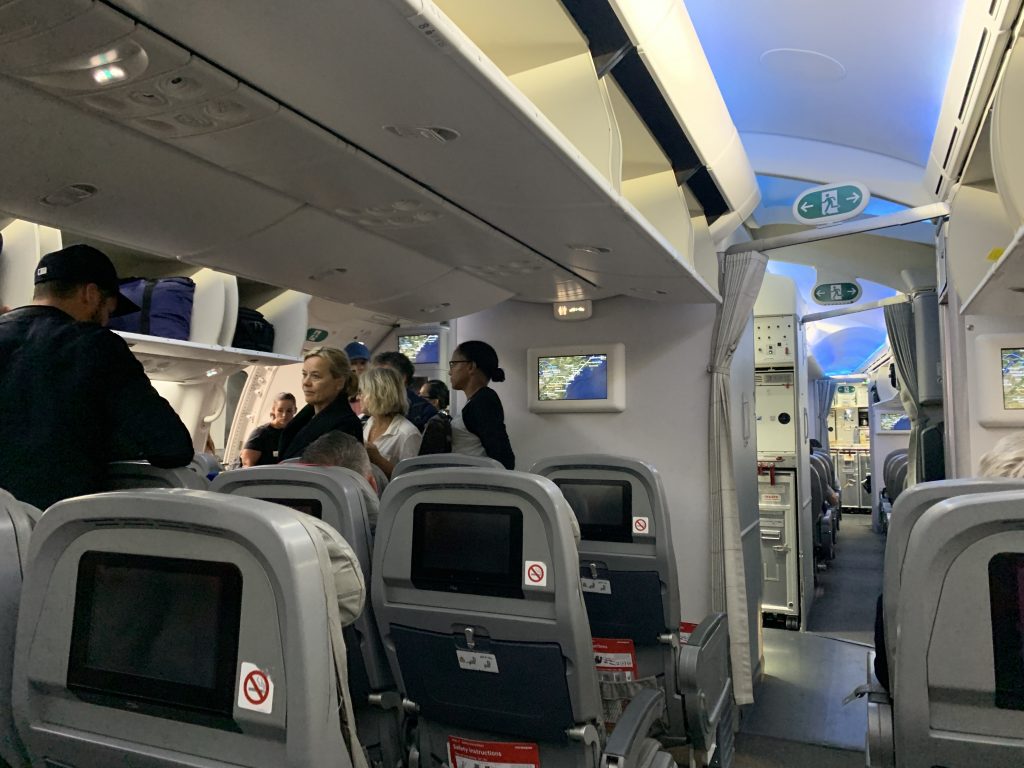 a group of people sitting in an airplane