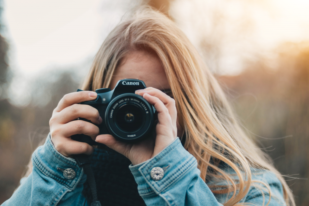 a woman holding a camera