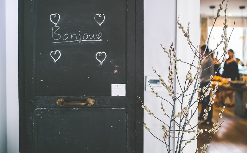 a black door with white writing on it