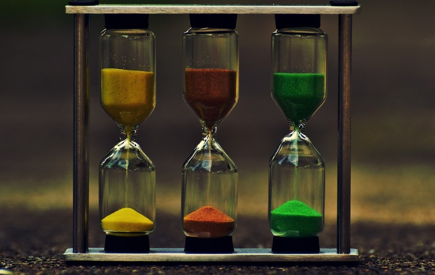 a group of hourglasses with different colored sand