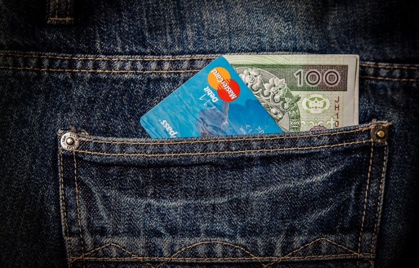a credit card and a credit card in a pocket of jeans