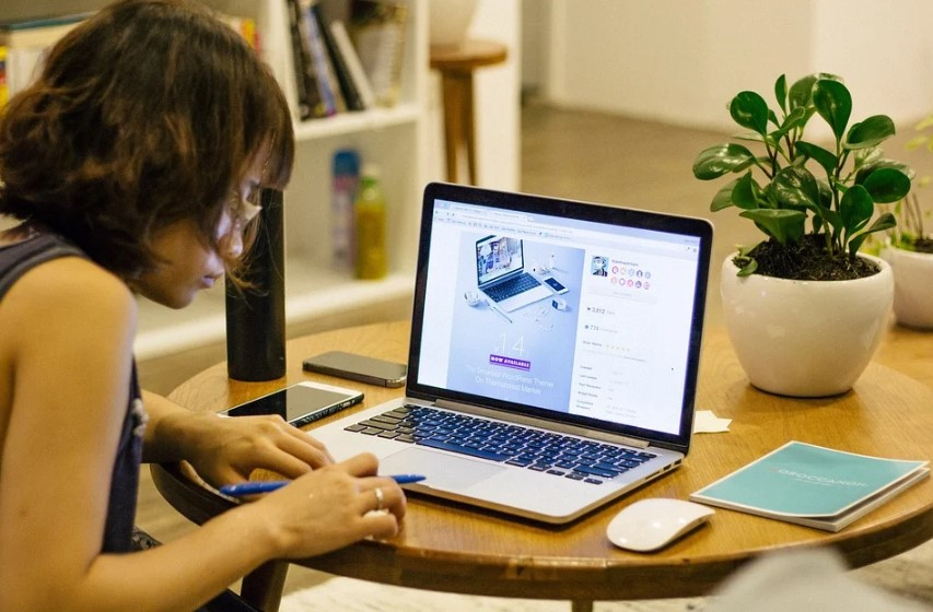 woman on laptop working at home