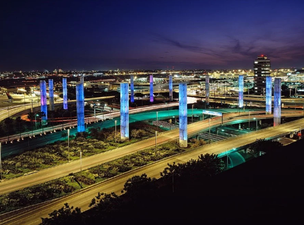 a city at night with many pillars