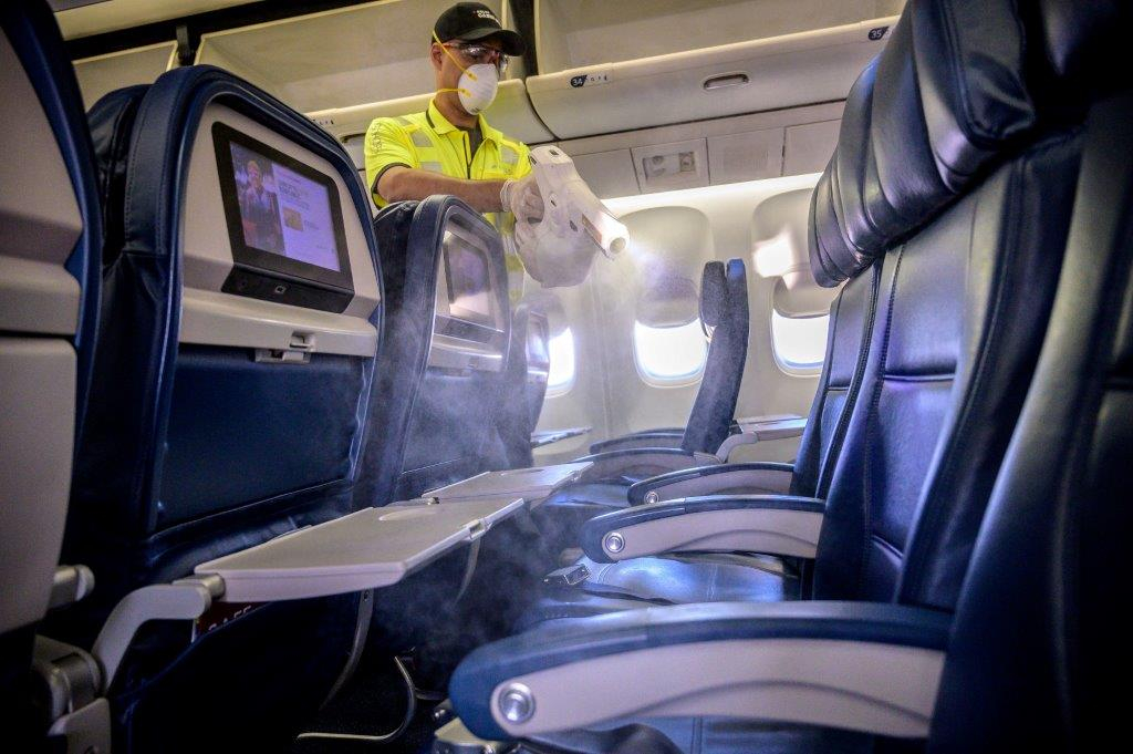 Delta Global Cleanliness Division cleaning seats on plane