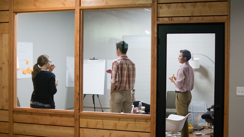 a group of people standing in a room