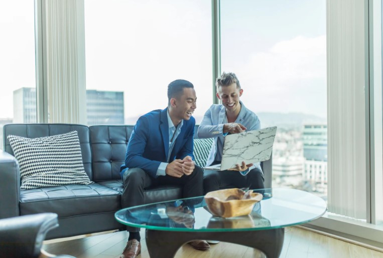 two men on laptop