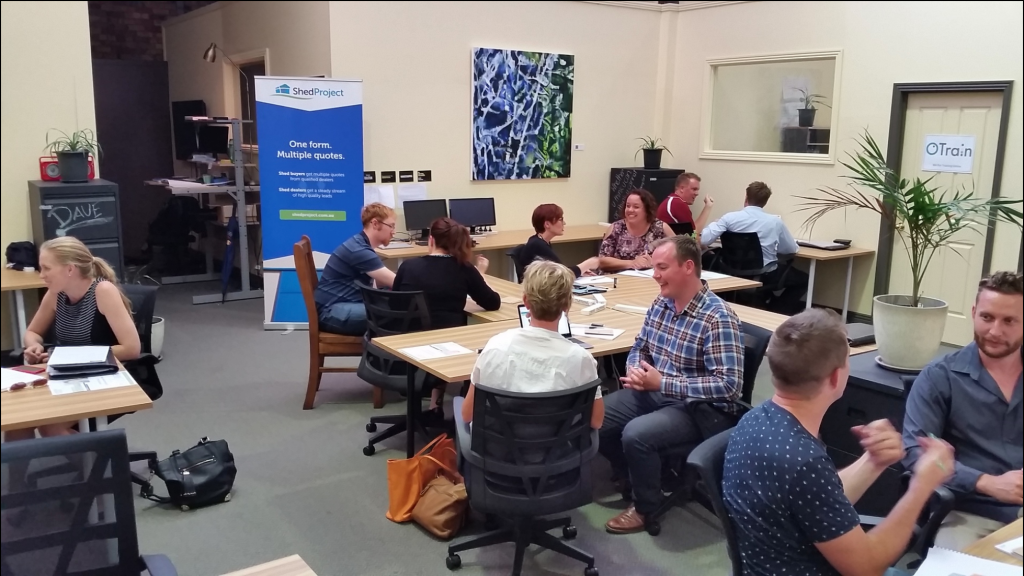 a group of people sitting around a table