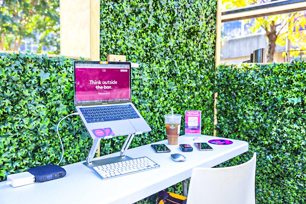 a laptop and cell phones on a table