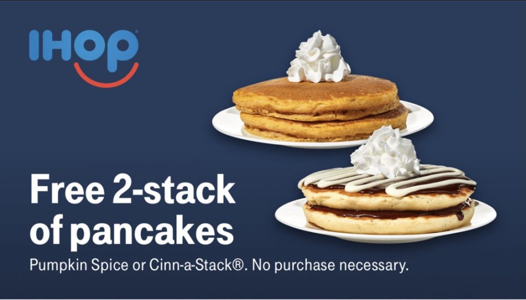 a stack of pancakes with whipped cream on top