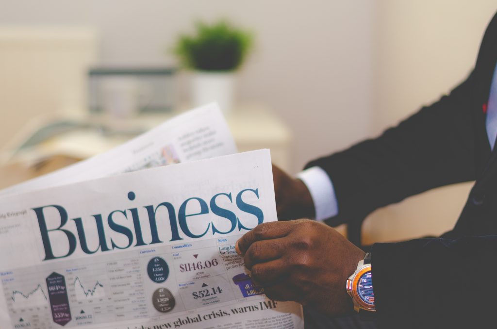 a man reading a newspaper