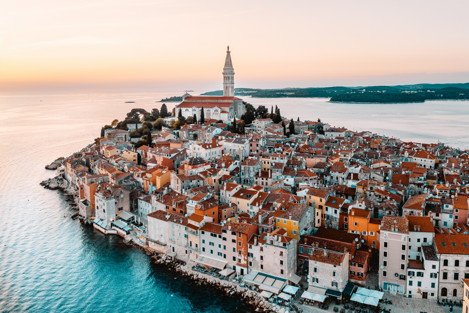 an aerial view of a city by the water